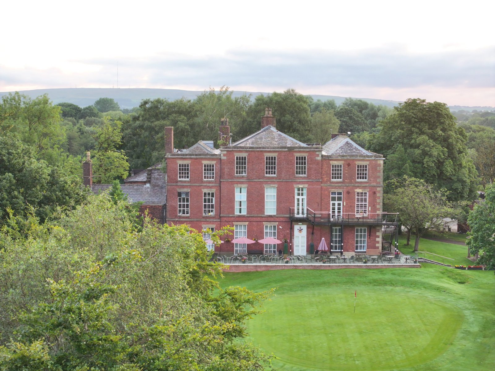 Drone shot showing clubhouse and Hall t at Hindley Hall Golf Club