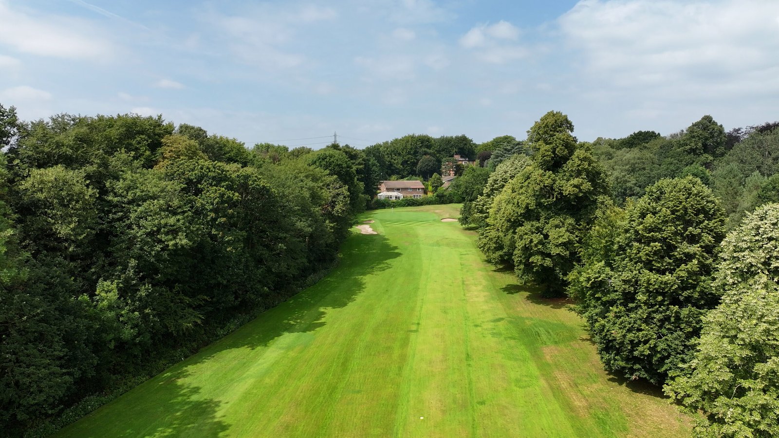Cinematic fairway perspective from drone at Worsley Golf Club